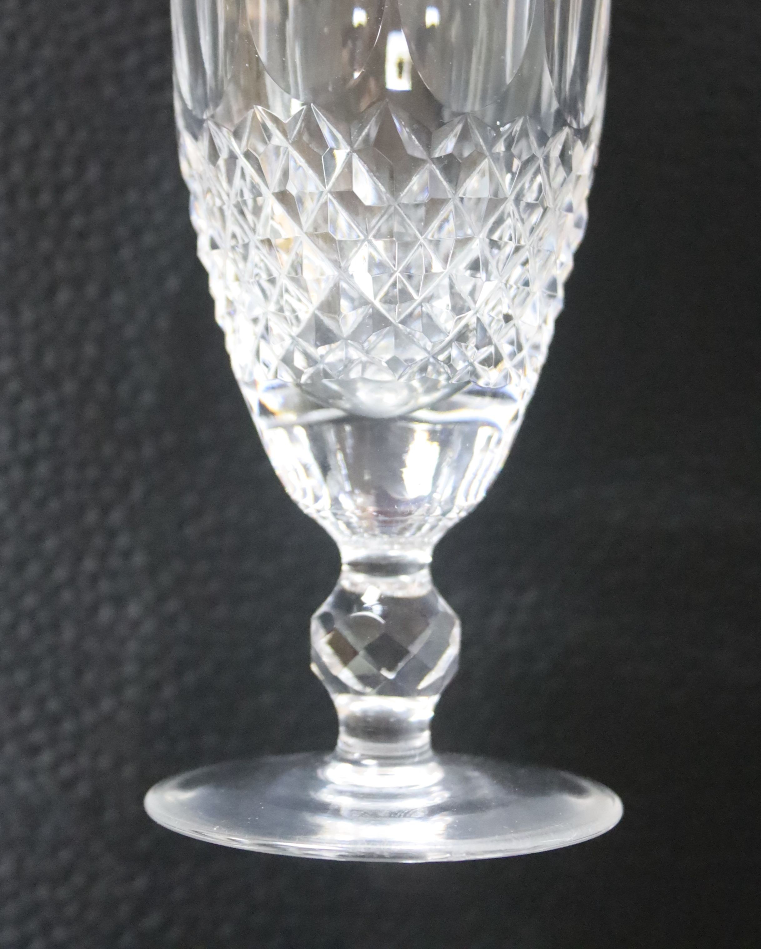 A set of six Waterford cut crystal 'Colleen' champagne flutes, 15.5cm